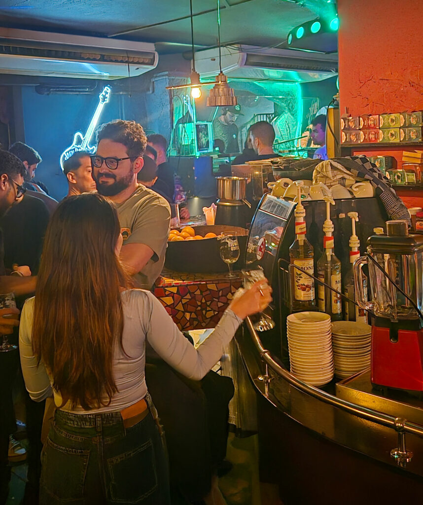 The bar at night with glowing lanterns and the mosaic counter